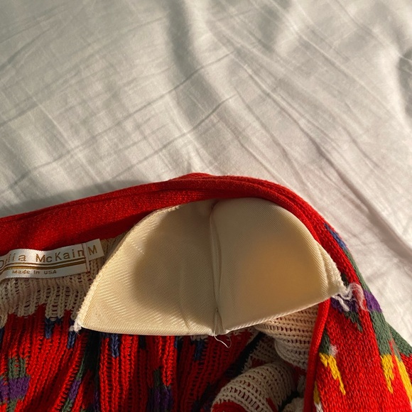 A Southwestern style sweater jacket with 5 silver colored buttons. - Picture 5 of 5